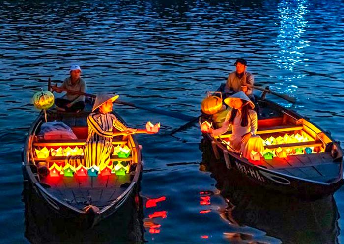 Take a boat on the Thu Bon River at night