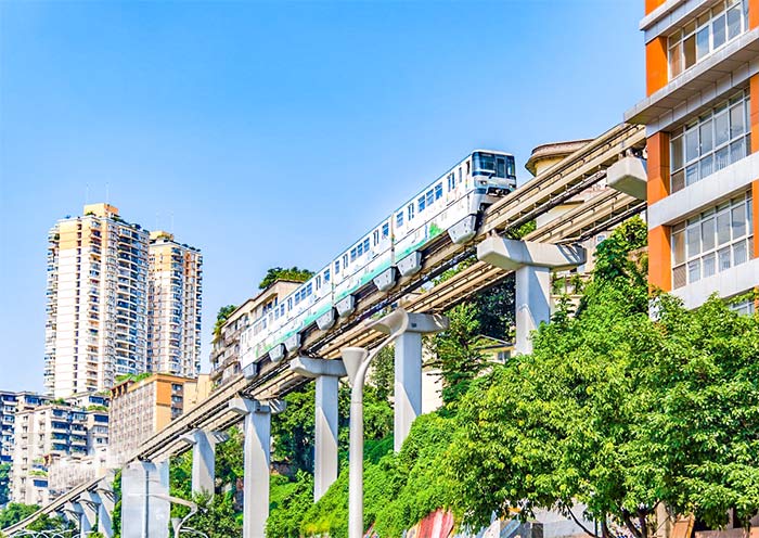 Train going through a 11-storey block of flats